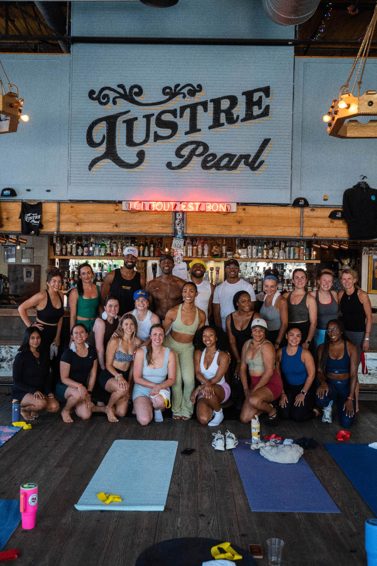 Big group photo after a class at Lustre Pearl bar